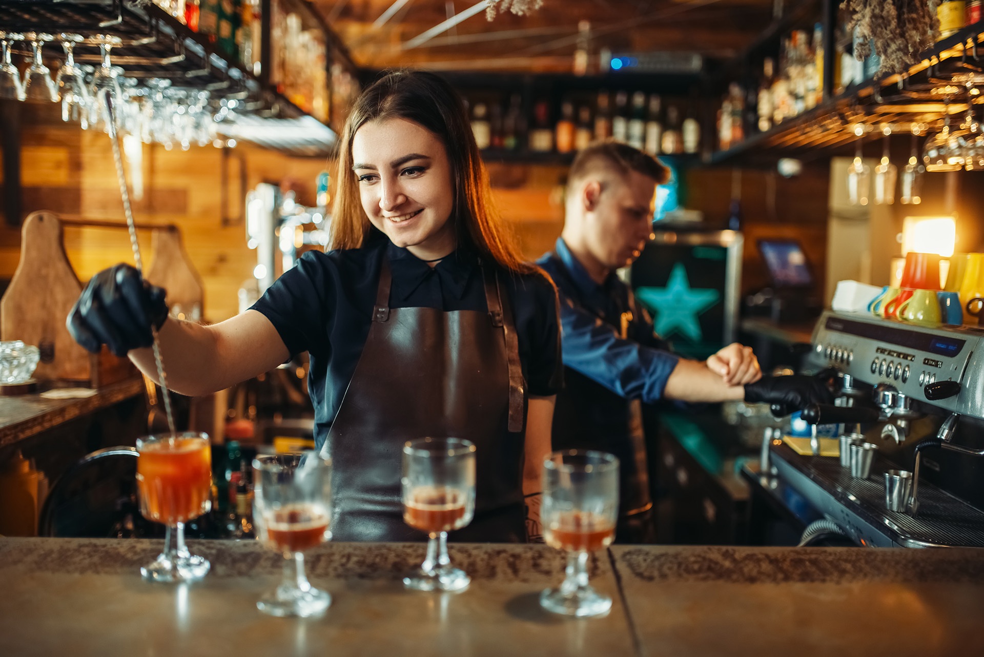 female bartender mixing a drink
